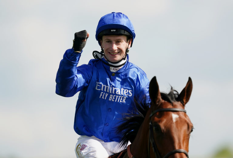 Jockey Oisin Murphy celebrates on board Mawj after winning the 1000 Guineas Stakes