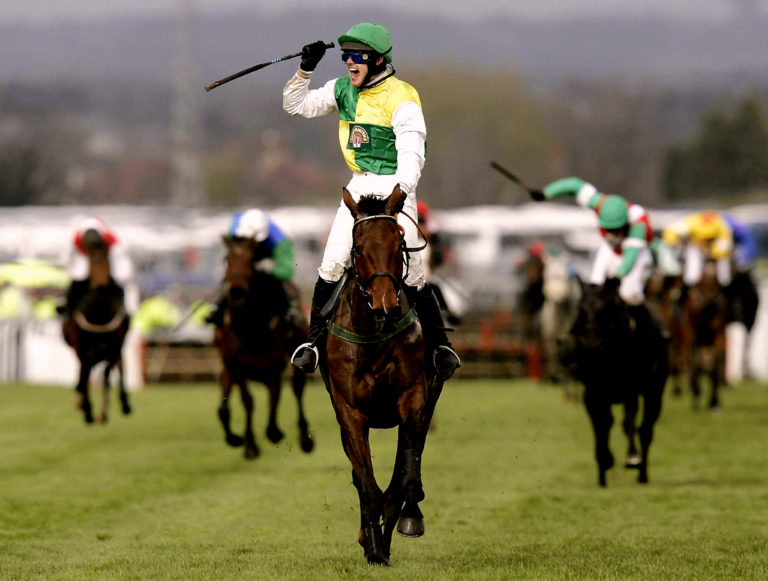 Ruby Walsh salutes the Aintree crowd aboard Hedgehunter