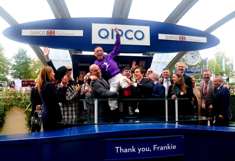 Dettori is raised aloft, surrounded by family and friends