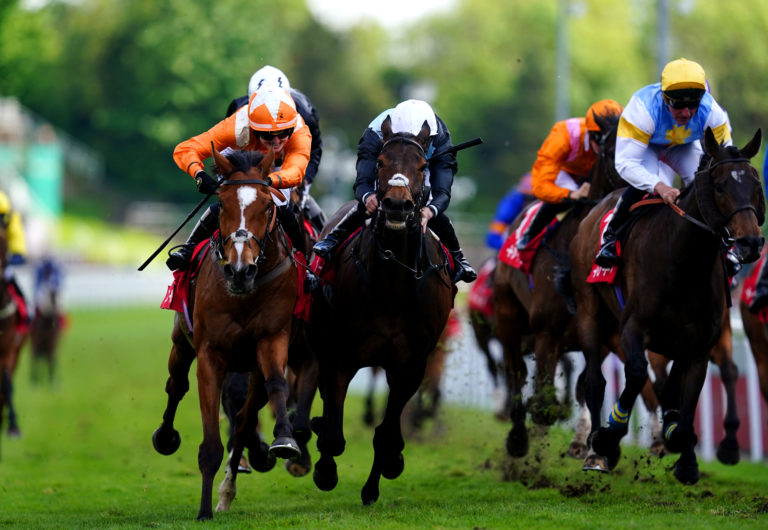 Metier (left) on his way to winning the Chester Cup
