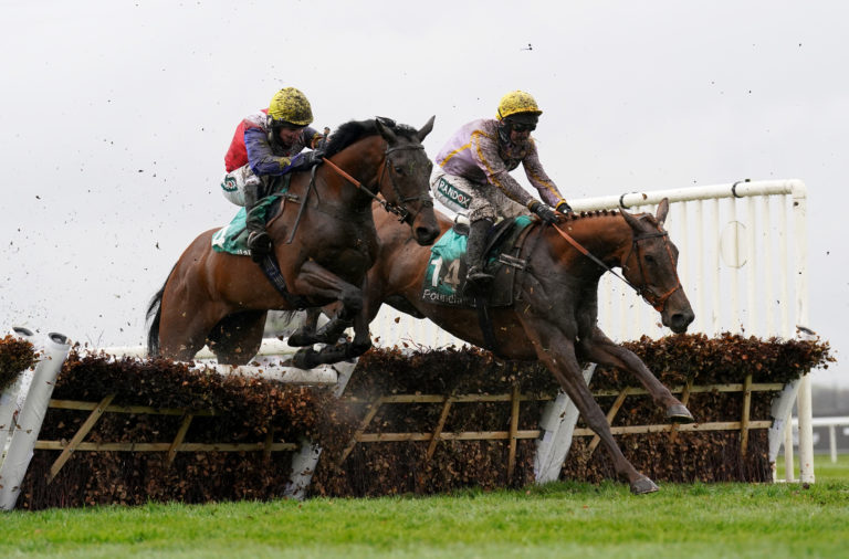 Hansard and Jamie Moore (left) in action at Aintree in April