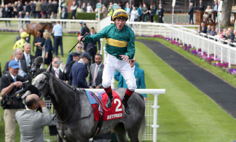 Frankie Dettori celebrates after winning aboard Coronet