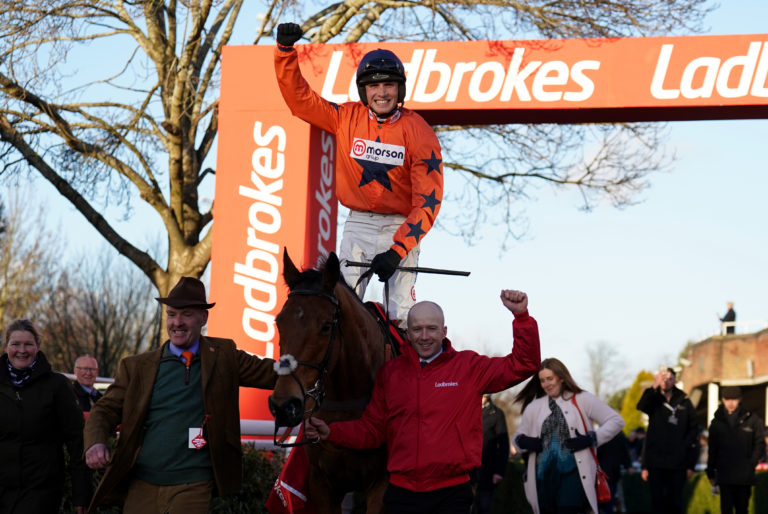 Harry Cobden celebrates winning King George VI Chase aboard Bravemansgame