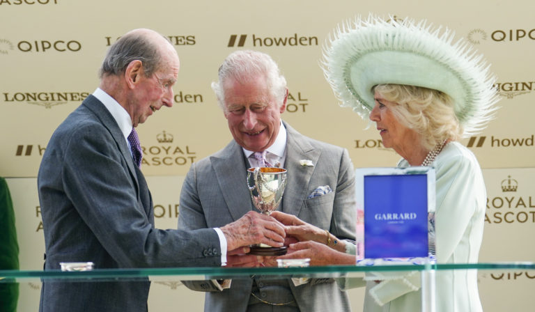 King Charles III and Queen Camilla are presented with their trophy by the Duke of Kent