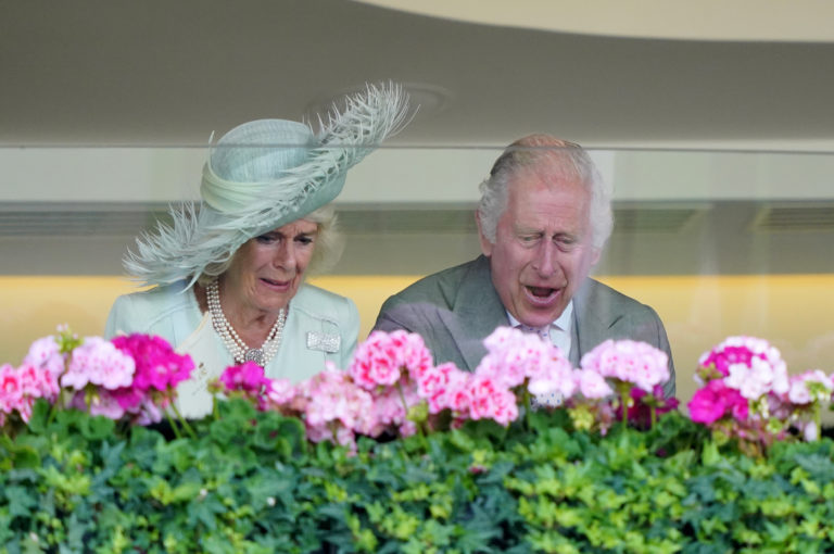 The King and Queen cheer on their Royal Ascot winner Desert Hero
