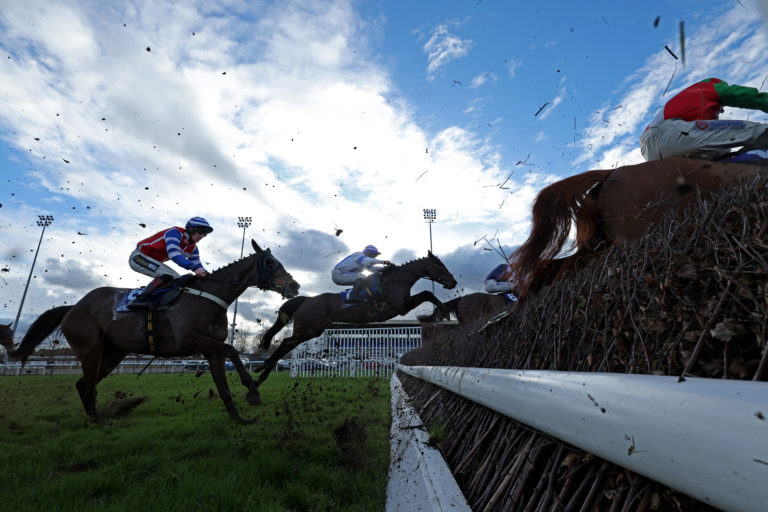 Forward Plan (centre) still had plenty to do jumping the last