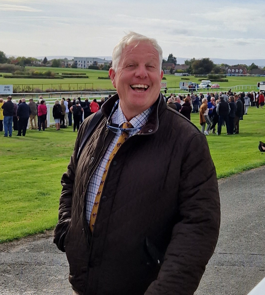 Andy Edwards (left) leading in L'Homme Presse after his win in the Brown Advisory Novices' Chase