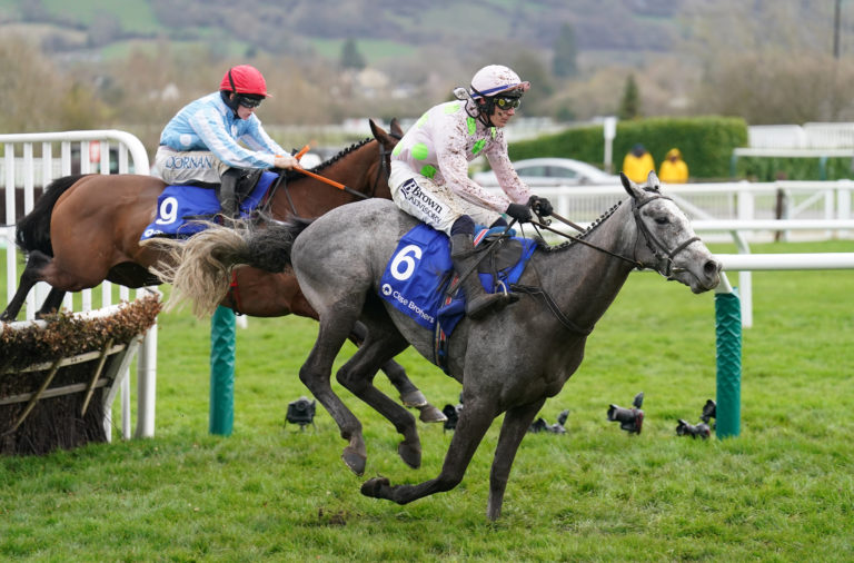 Telmesomethinggirl (red cap) bumped into Lossiemouth in the Mares' Hurdle