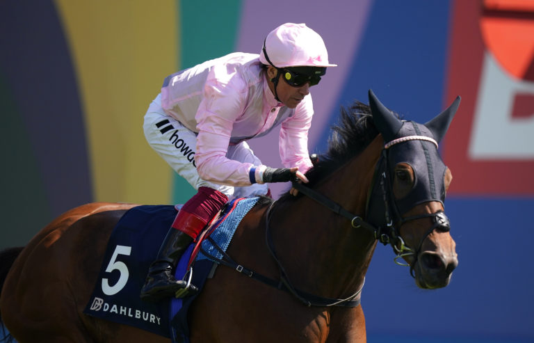 Emily Upjohn and Frankie Dettori winning the Coronation Cup at Epsom