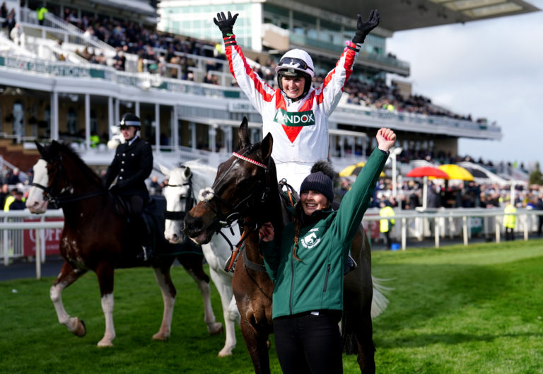 Gina Andrews celebrates on Latenightpass after winning the Randox Foxhunters' Open Hunters' Chase in 2022