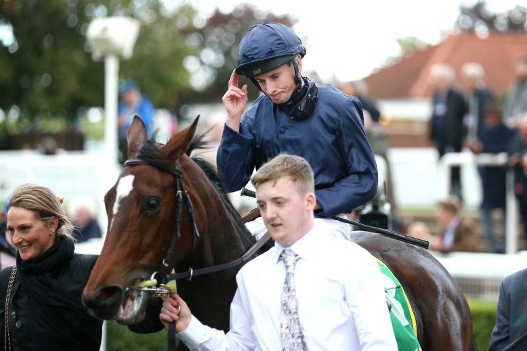 Ryan Moore and Ylang Ylang after winning the Fillies' Mile at Newmarket