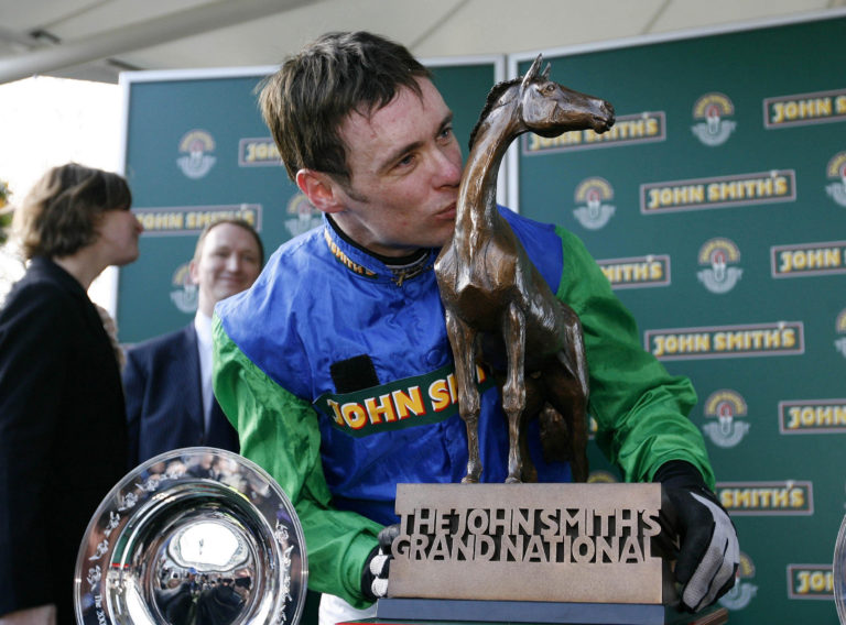 Timmy Murphy kisses the Grand National trophy
