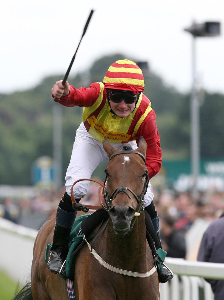 Freddy Tylicki salutes the crowd as Flying Clarets crosses the line