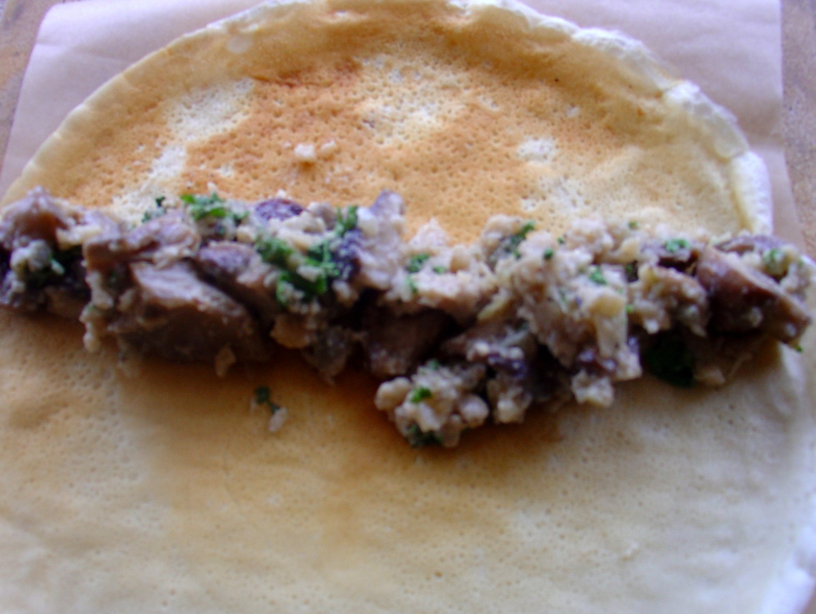 Putting Mushroom Stuffing Into Savoury Pancake