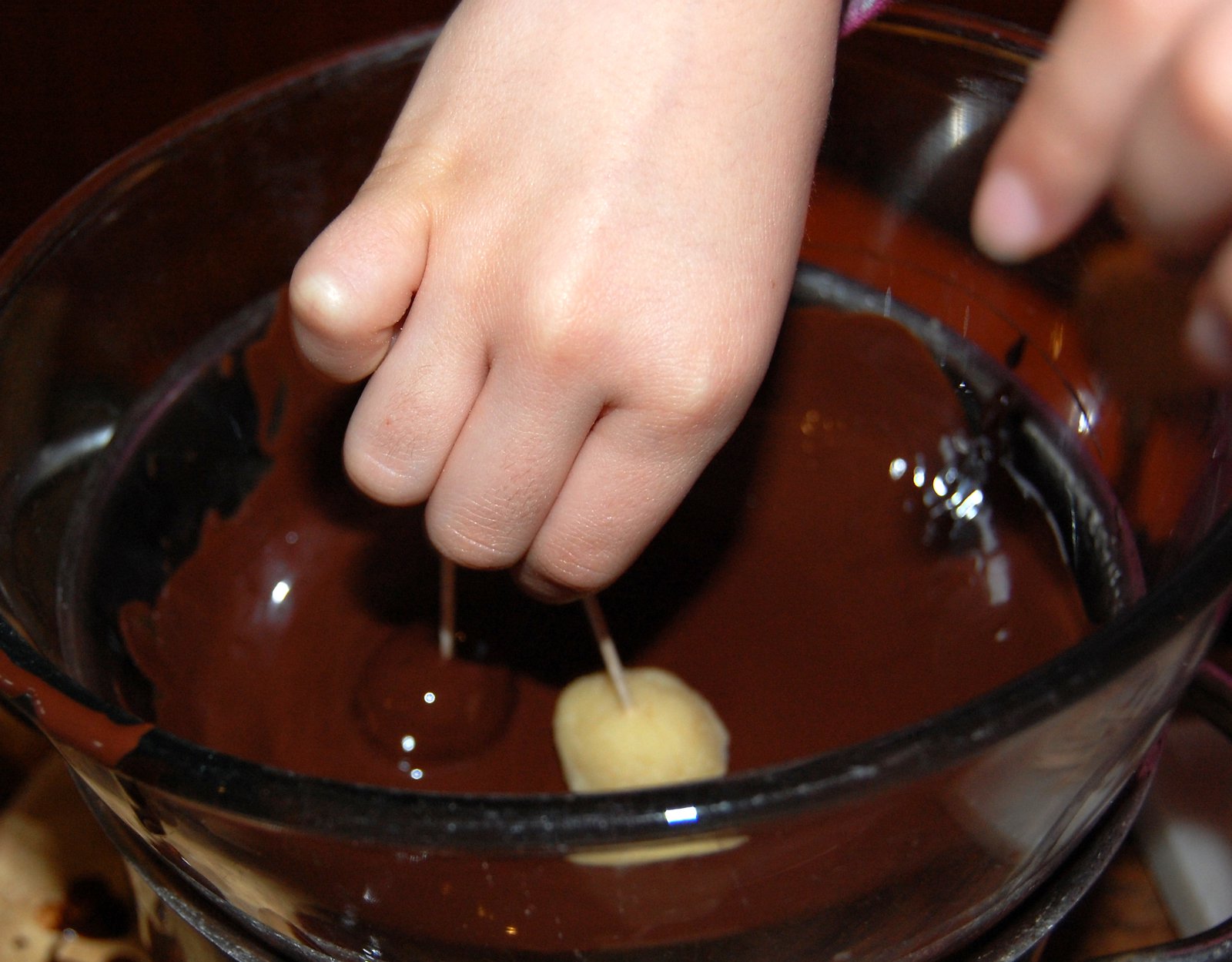 Coating marzipan in dark chocolate