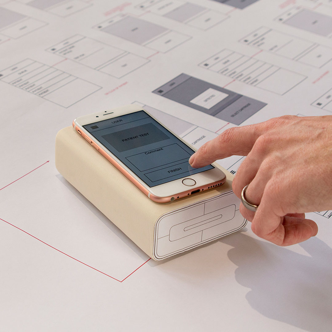 POC Diagnostics Device | Medical UX Design | Team Consulting Image showing the point of care diagnostics device UX interface function