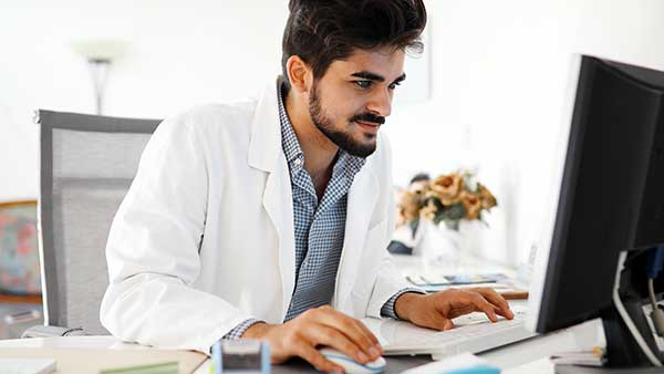 A young Doctor watching a business promo