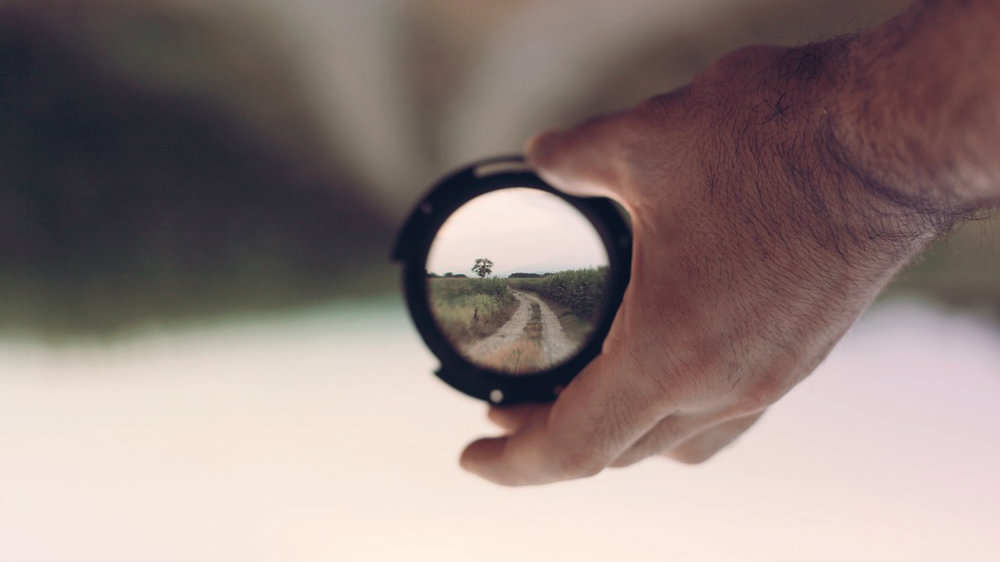 hand with inverted lens