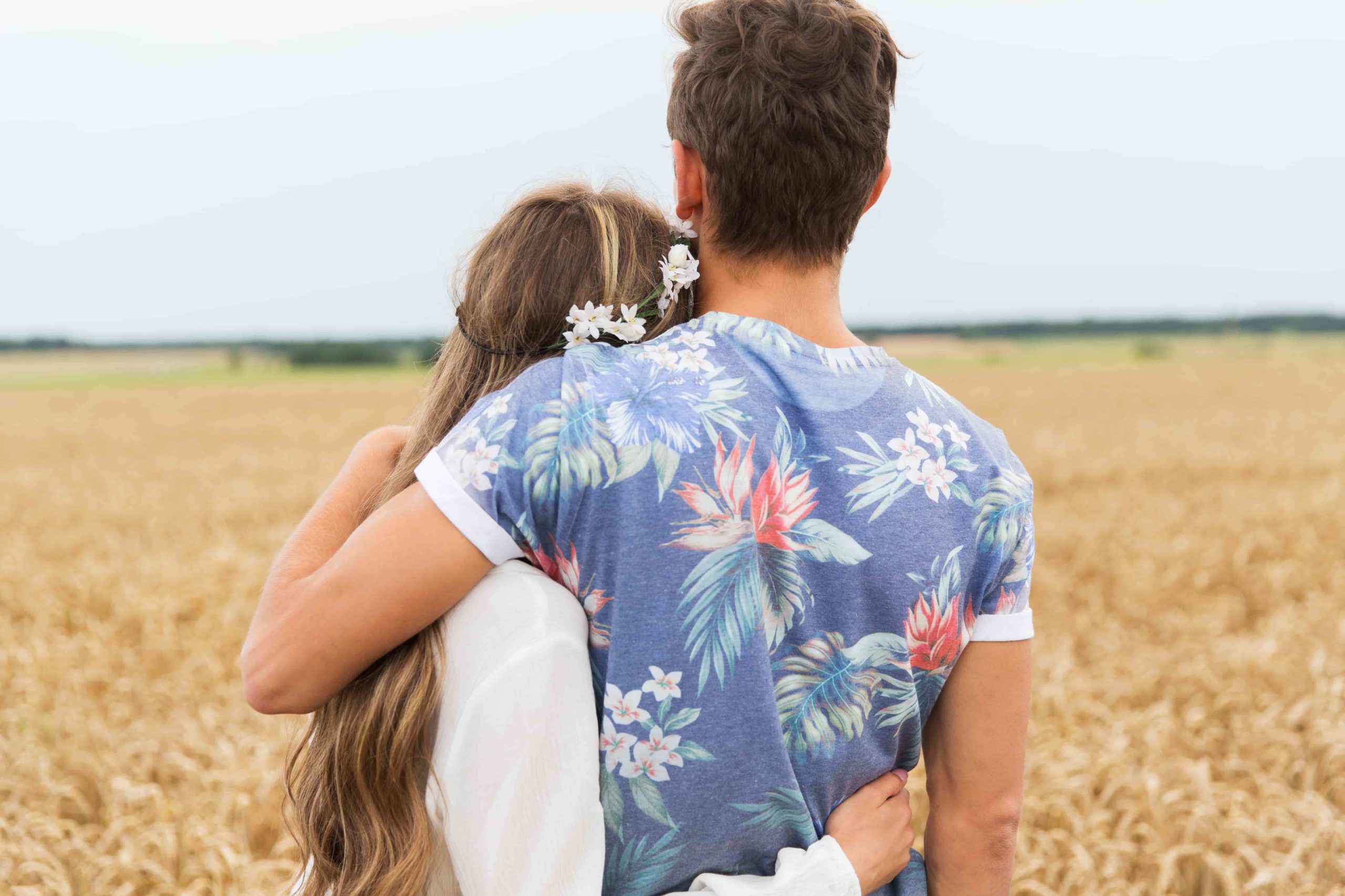 happy couple in field