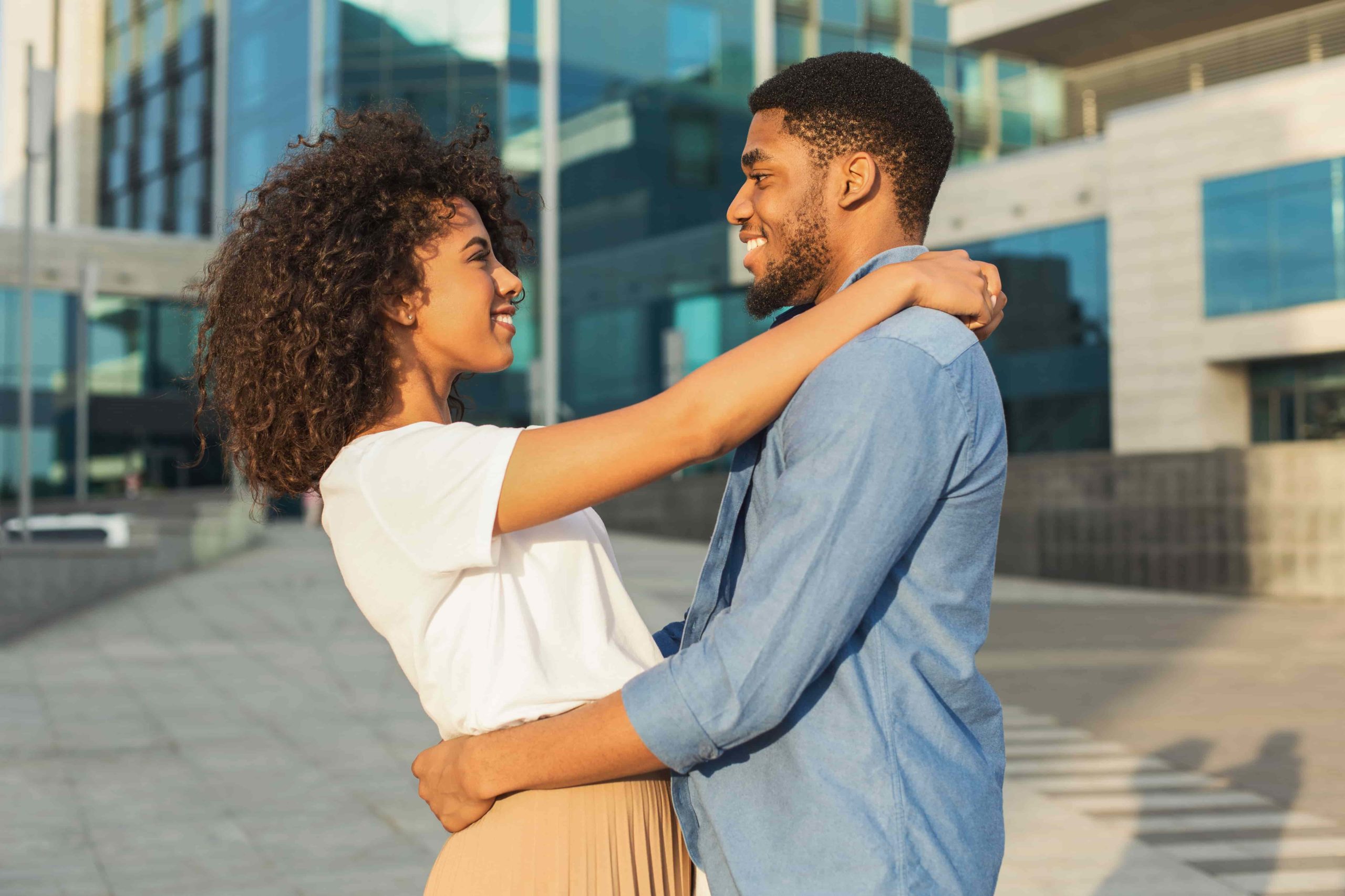 smiling couple hugging