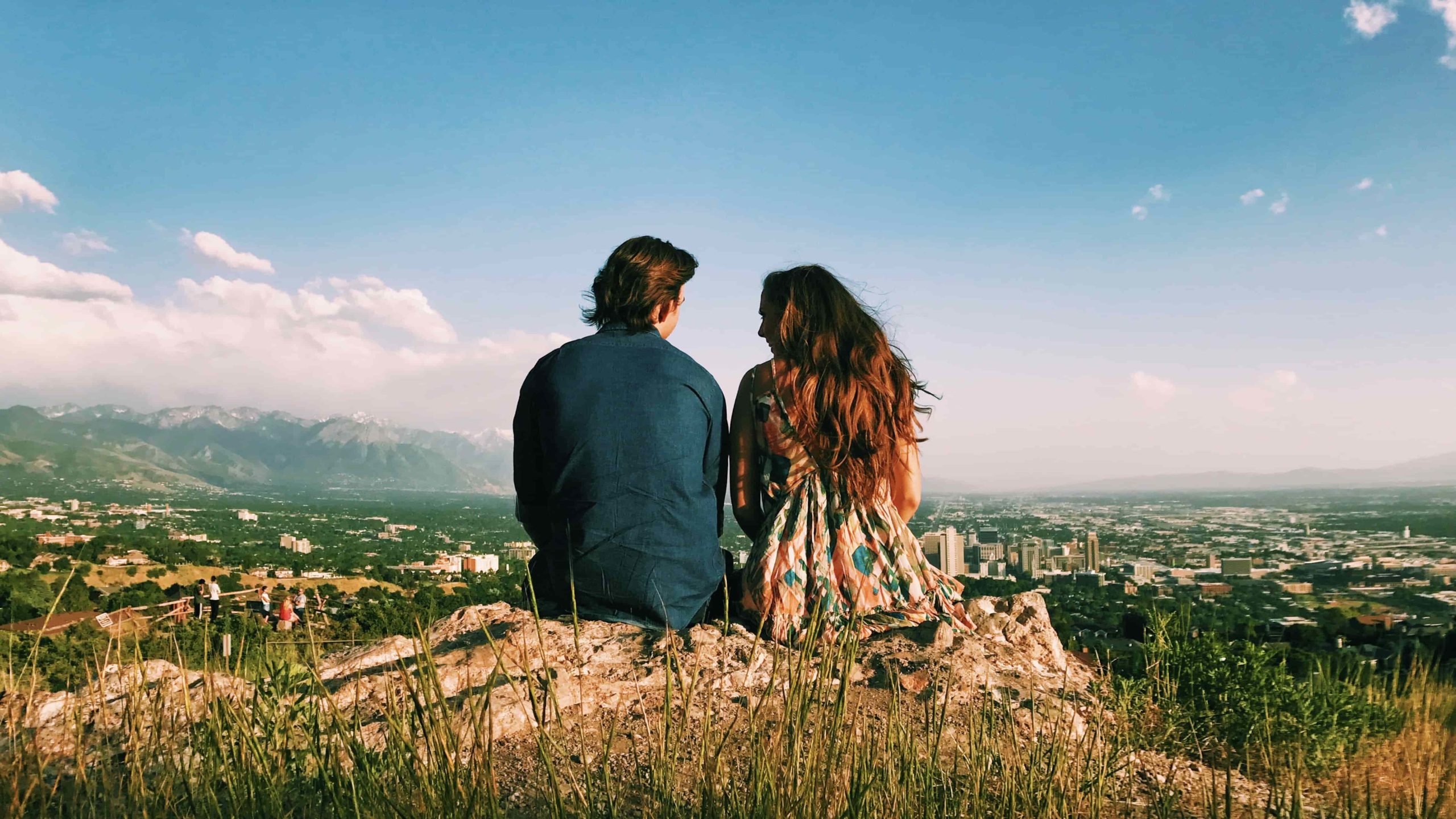 romantic couple on hill taking