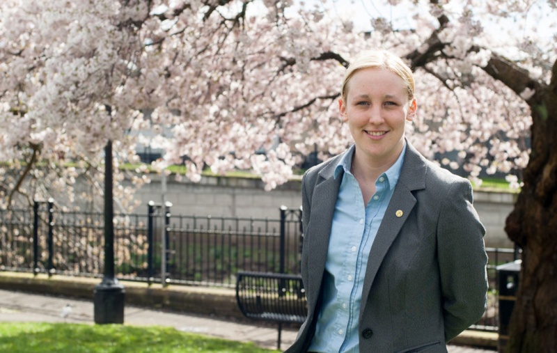 Mhairi Black standing in front of a tree
