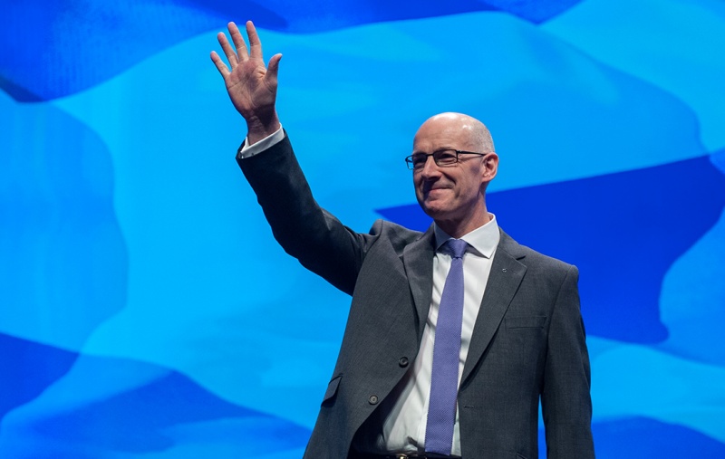 John Swinney waving to the crowd at Conference