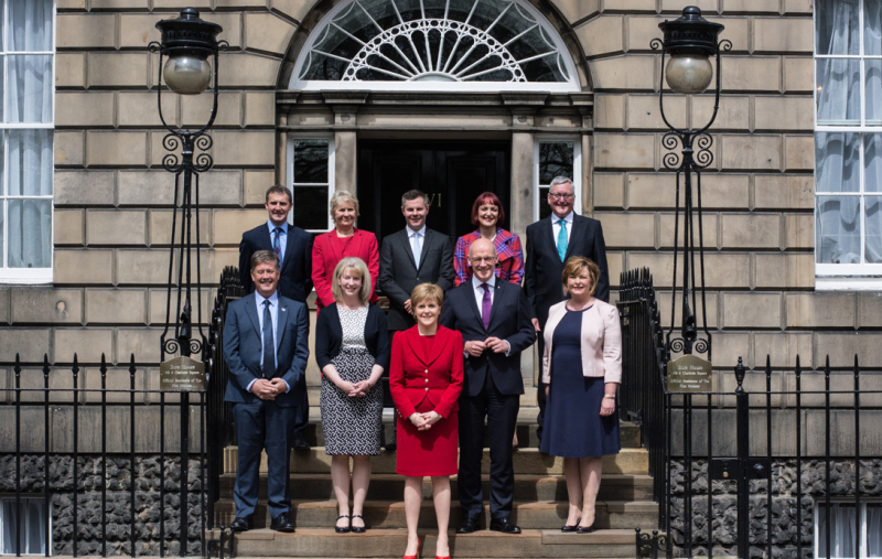 the SNP cabinet standing on the steps of Bute House