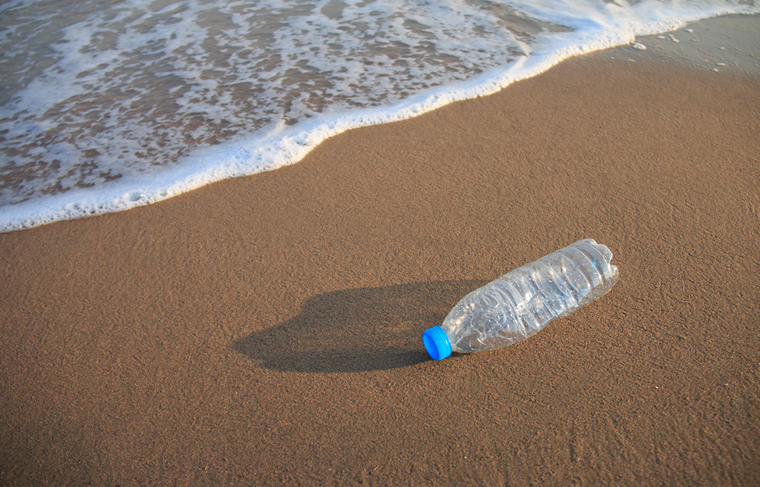 Plastic bottle lying on the beach