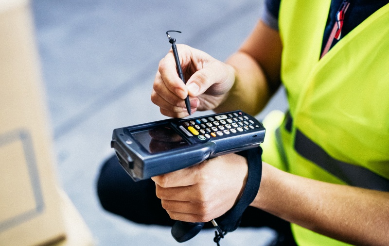 Male warehouse worker with barcode scanner.