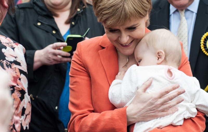 Nicola Sturgeon holding a baby