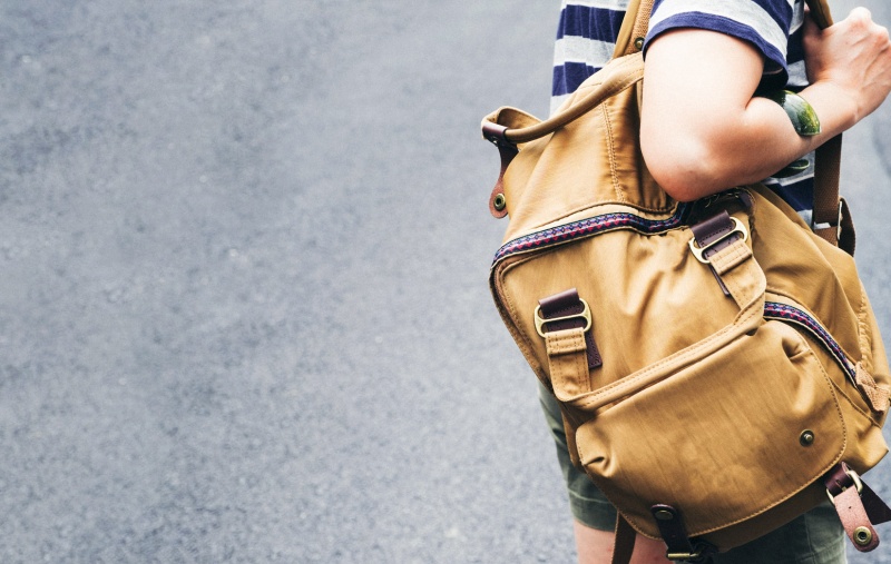 young person wearing a backpack