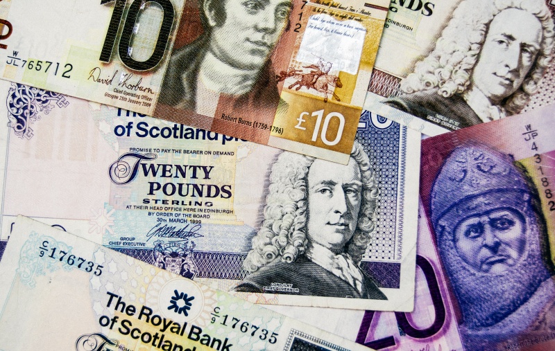a pile of Scottish banknotes