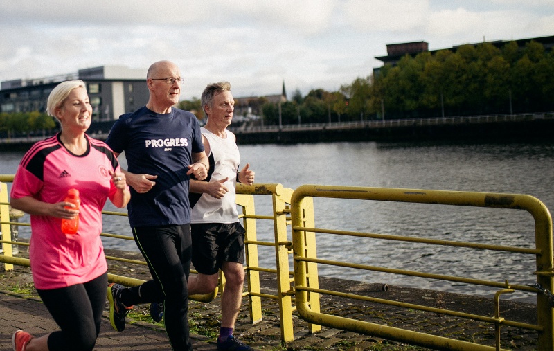 Hannah Bardell, John Swinney and Ivan McKee running by the Clyde