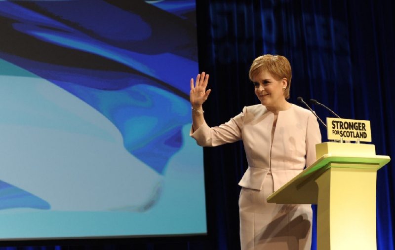 Nicola Sturgeon waving at Conference