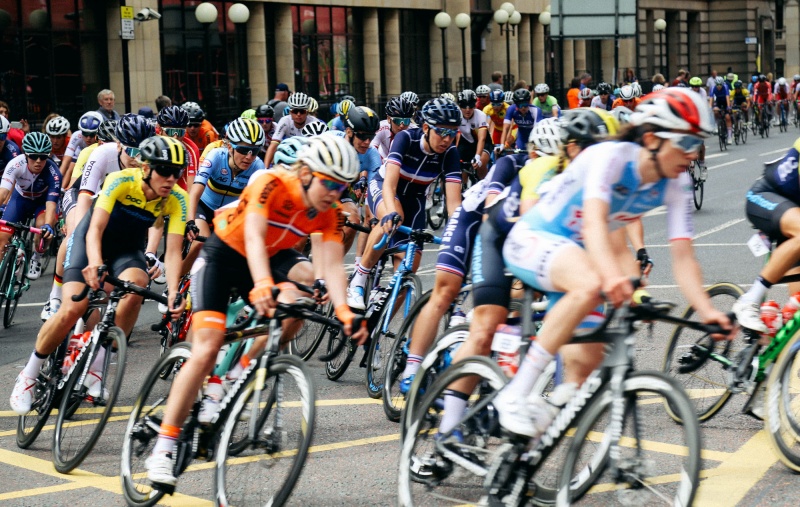 Competitive cyclists racing through the streets of Glasgow