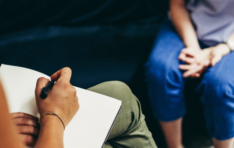 A person talking to their psychologist