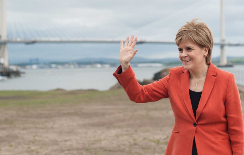 Nicola Sturgeon standing in front of the Queensferry Crossing