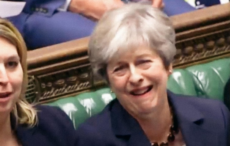 Theresa May laughing at PMQs