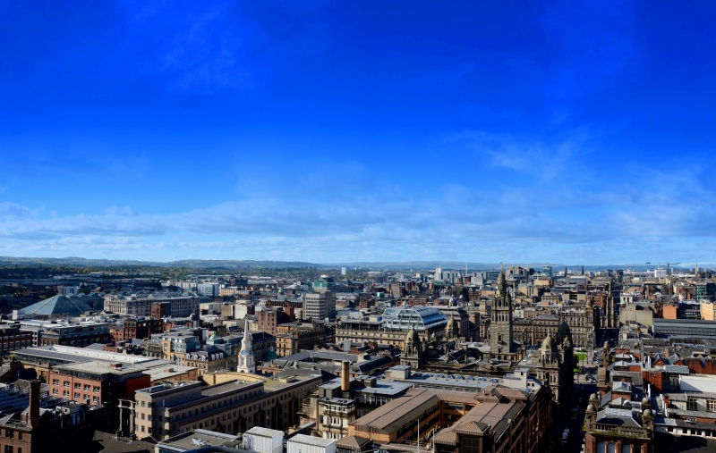 Glasgow under a deep blue sky