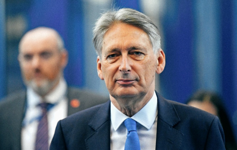 Britain's Chancellor of the Exchequer Philip Hammond arrives at the ICC for the third day of the Conservative Party Conference in Birmingham