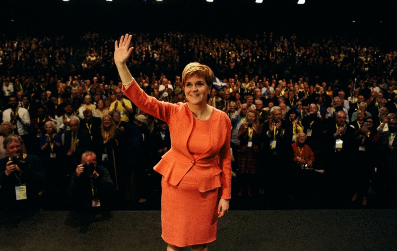 Nicola Sturgeon waving at Conference