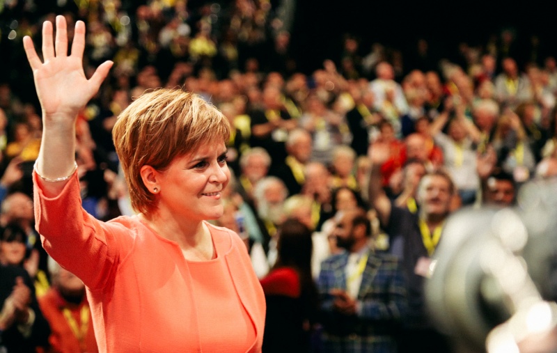 Nicola Sturgeon waving at Conference