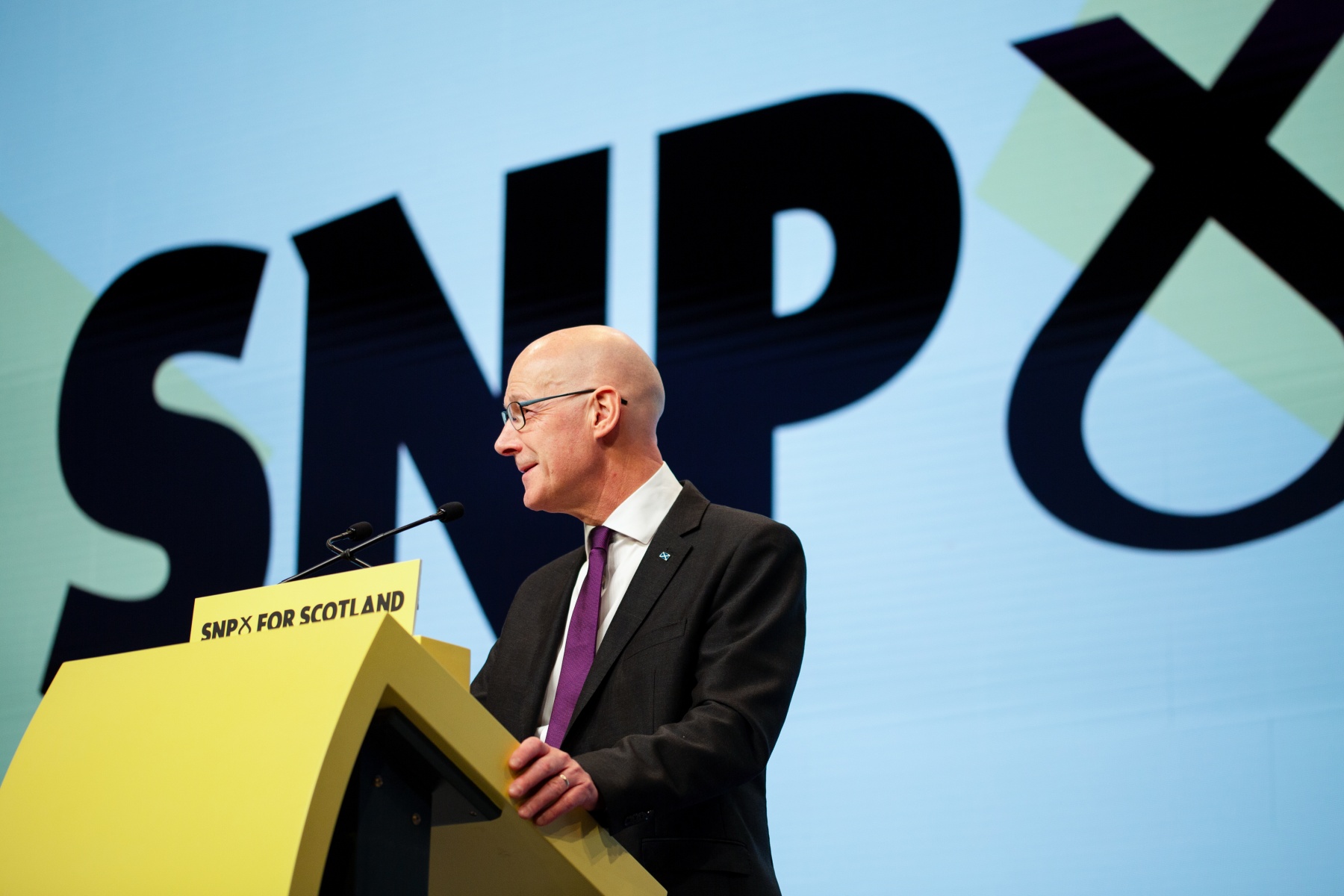 John Swinney on stage at Conference