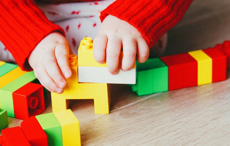 child playing with building blocks